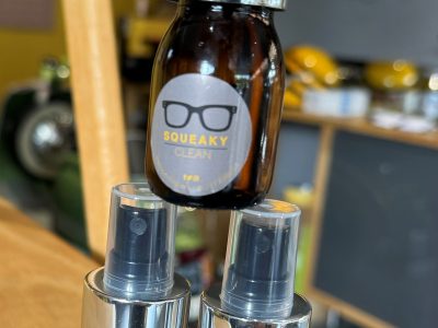 stacked bottles of Squeaky Clean, only available at EYES on St Albans