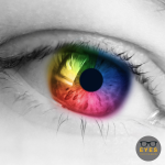 black and white image of an eye - with the iris artifically coloured to include the colours of the rainbow EYES on St Albans style